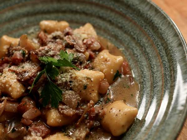 black truffle gnocchi with guanciale and mushrooms